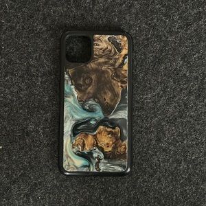 Carved one of a kind phone case for iPhone 11.